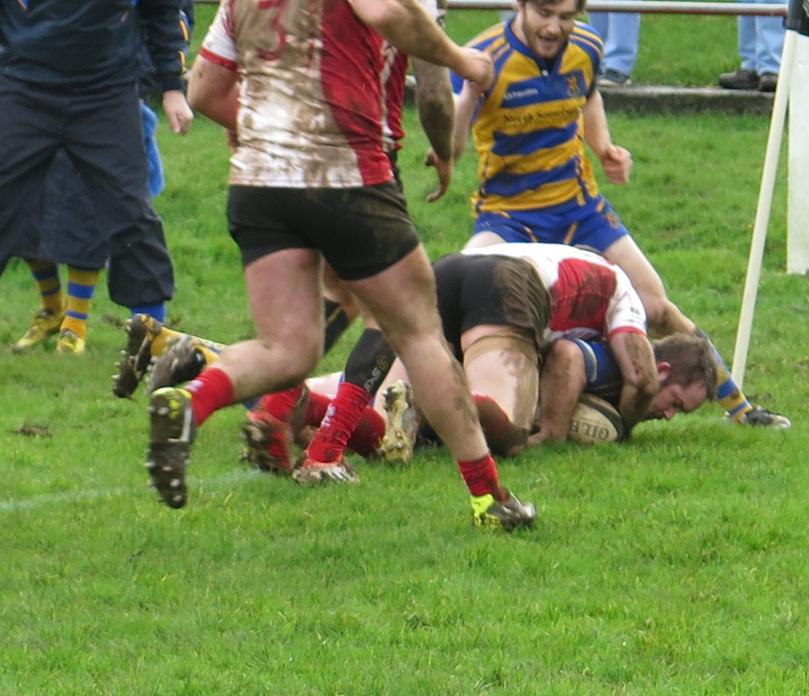 Crunch: Mattie Honour barges over for Clevedon